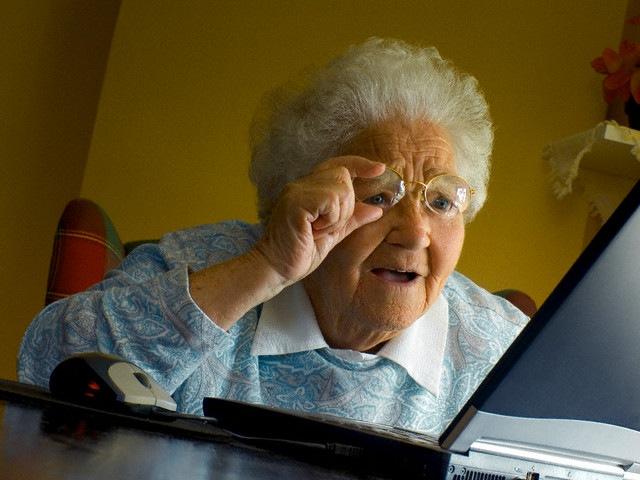 old woman surprised by computer