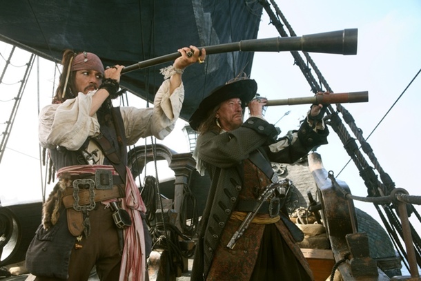 movie pirates Jack Sparrow and Barbossa holding telescopes