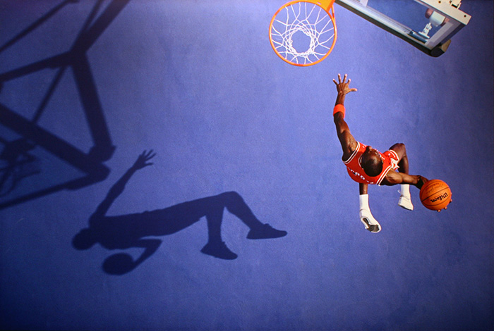 Michael Jordan soaring towards a hoop