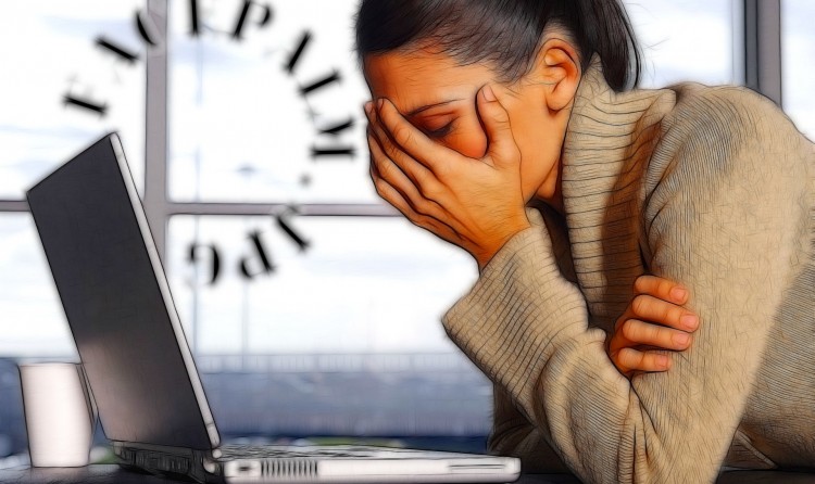 upset woman in front of laptop