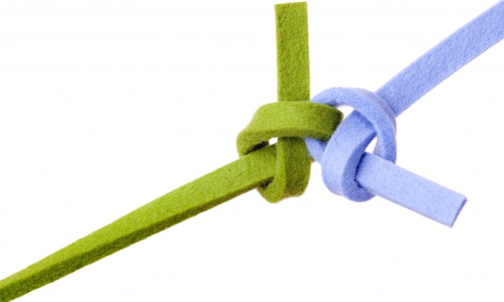 green and blue strands tied in knot