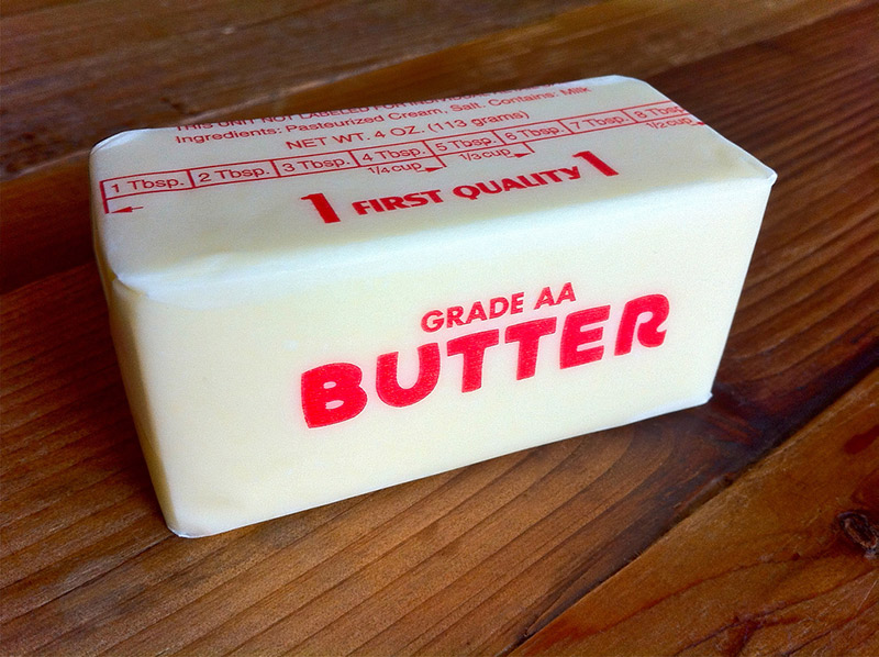 stick of butter in wax paper