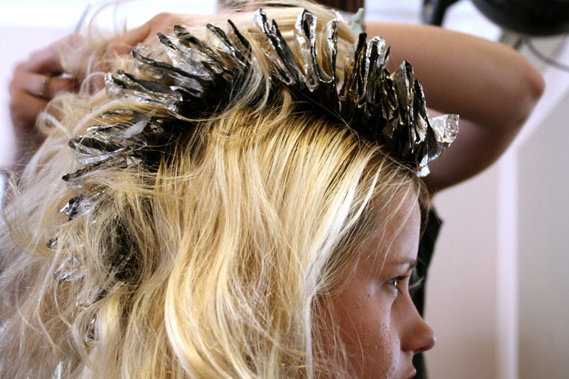 woman getting her hair dyed