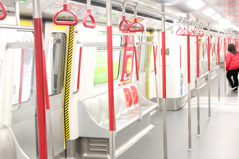 seats and hand holds inside train