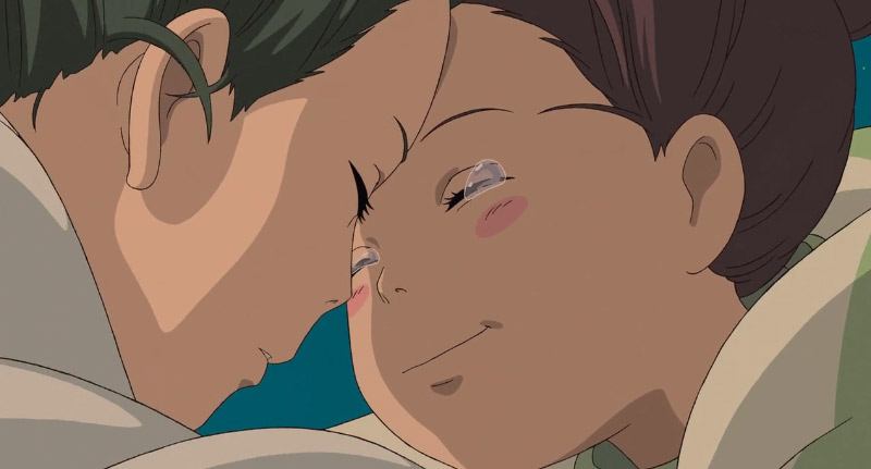 Screenshot of Chihiro and Haku embracing in Spirited Away