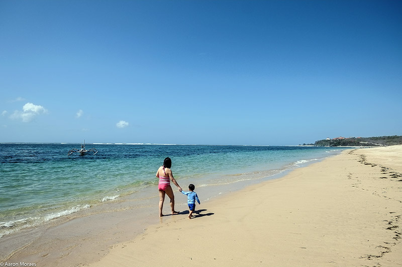 mother and son on a beach in deep water