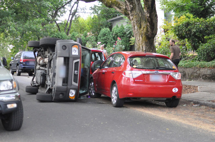 A Honda automobile crashed on its side