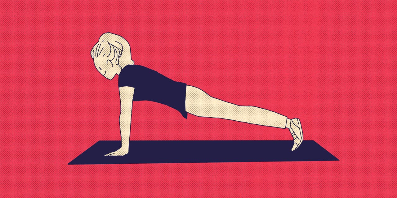 woman doing push ups on a mat