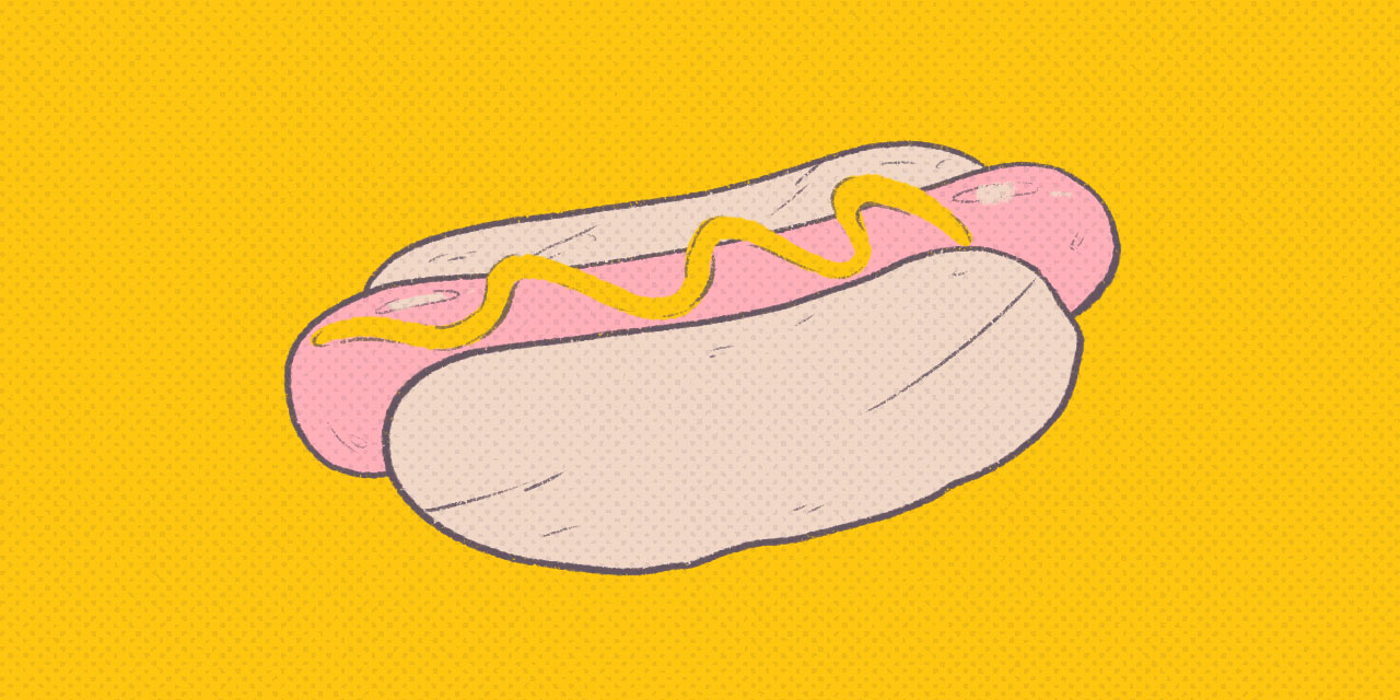 hot dog in a bun with mustard