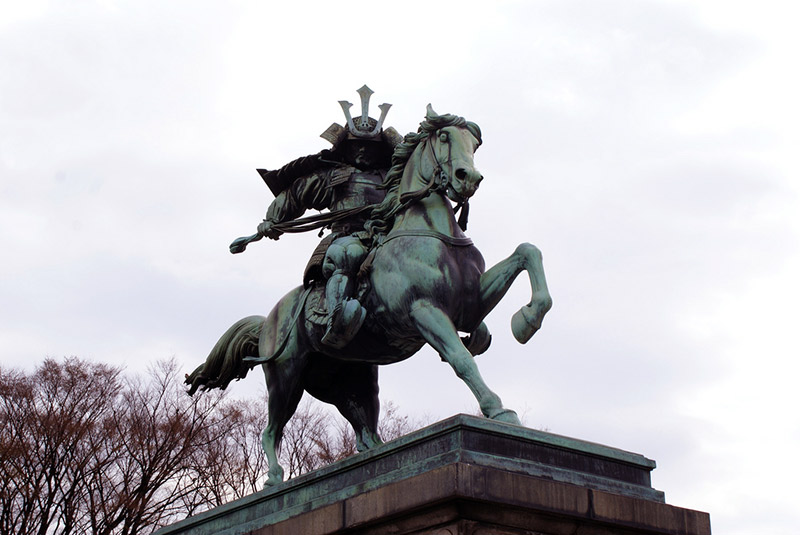 statue of samurai on horseback