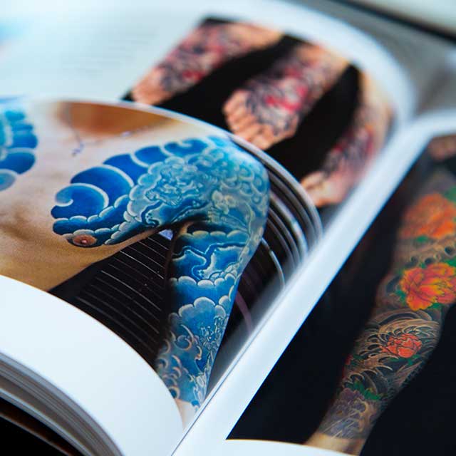 blue wave irezumi in a book