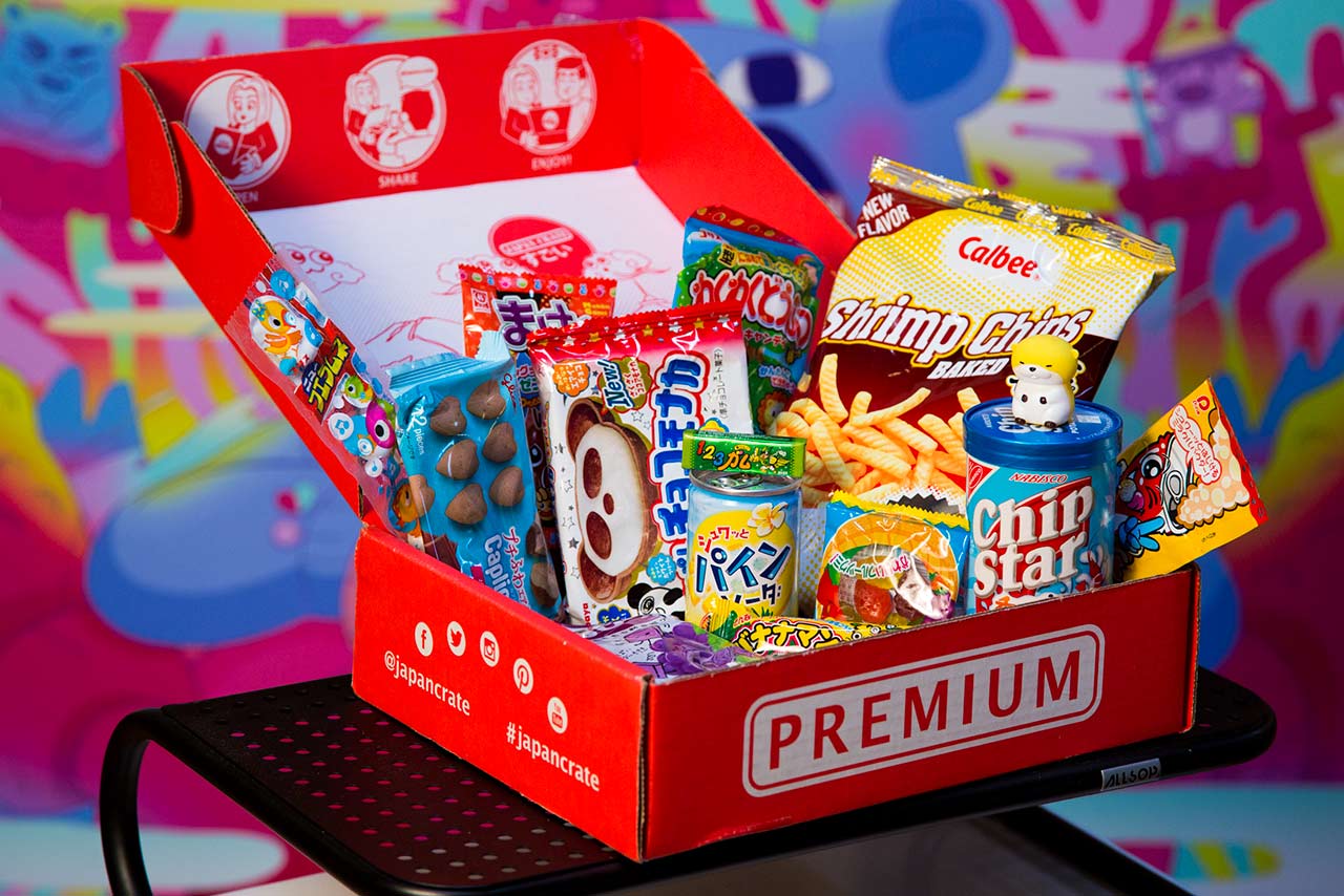 red subscription box displaying japanese snacks