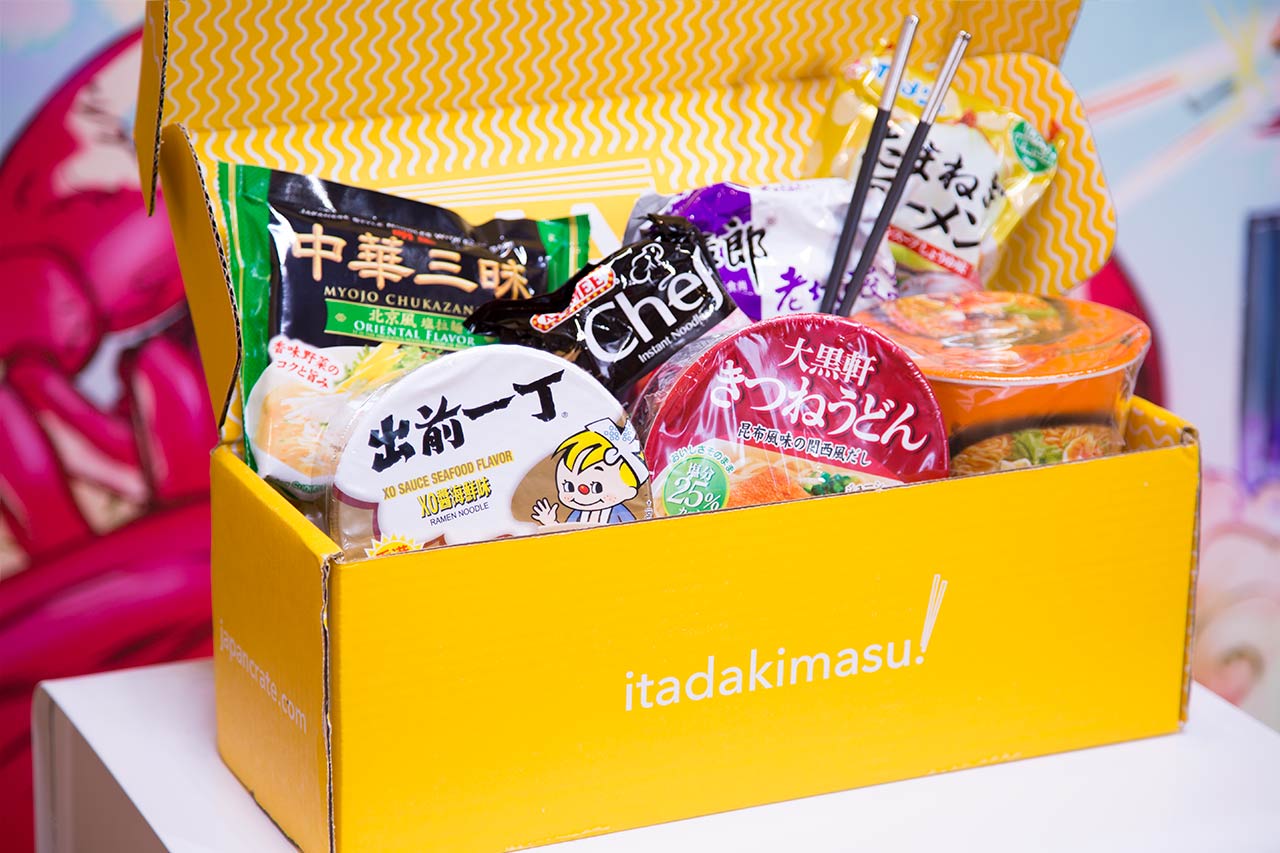 bright yellow cardboard box filled with instant noodle packages