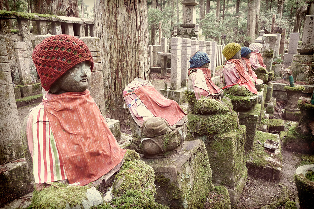 stone statues with knit caps