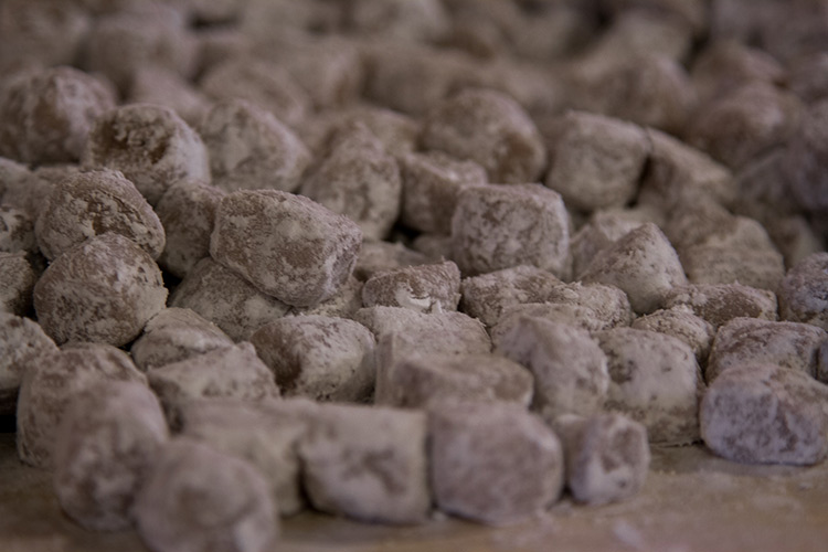 floured meat on a table