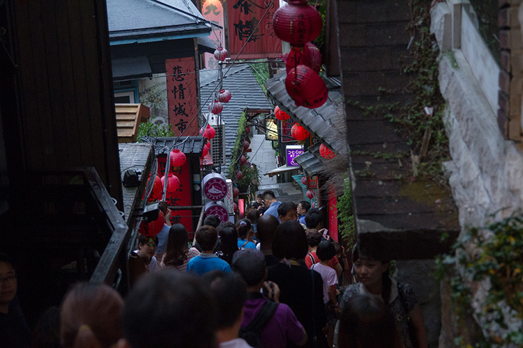 crowd of people on stairs in jiufen