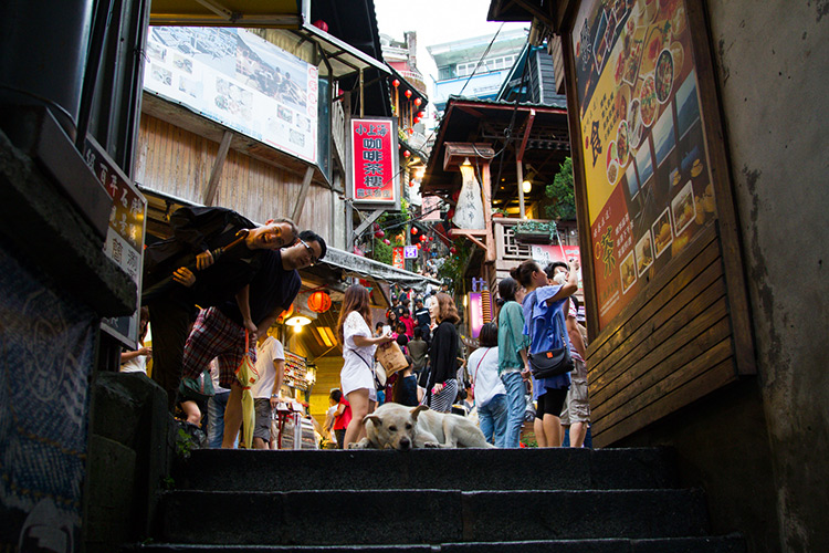 two people being cute on the stairs in jiufen