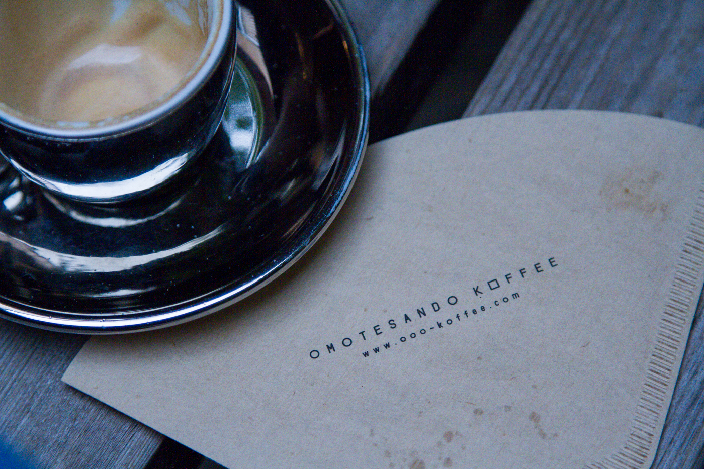 top view of coffee cup and napkin printed with omotesando koffee