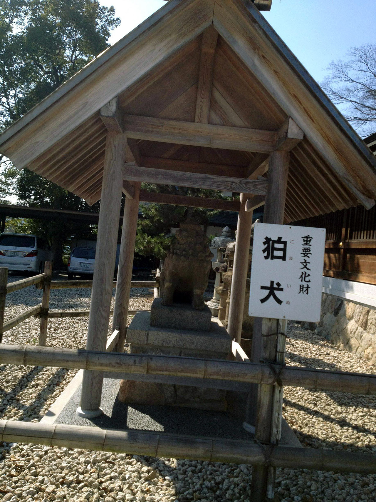 tilted picture of a small wooden building shrine