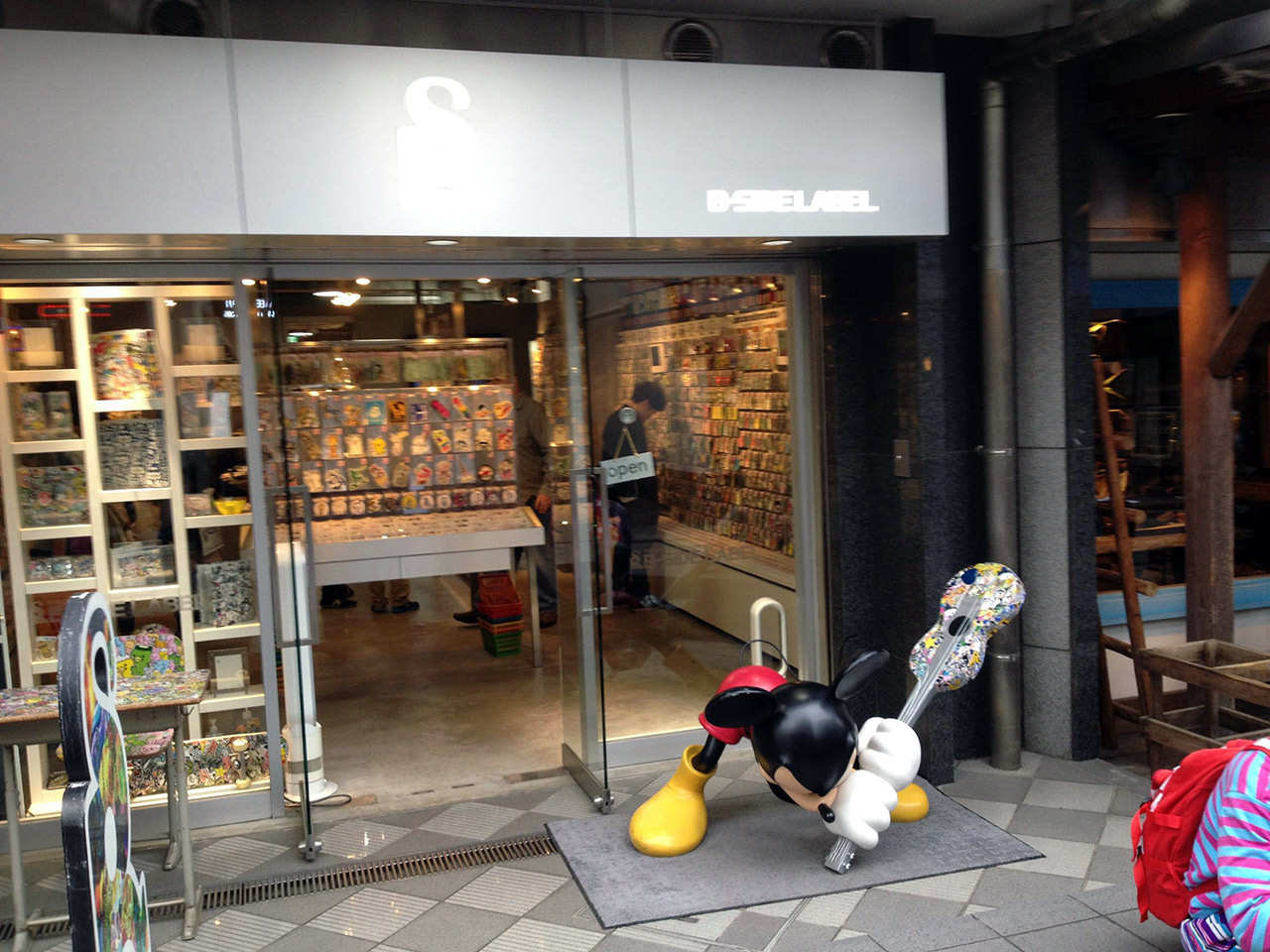 sticker store in japan with mickey mouse smashing guitar