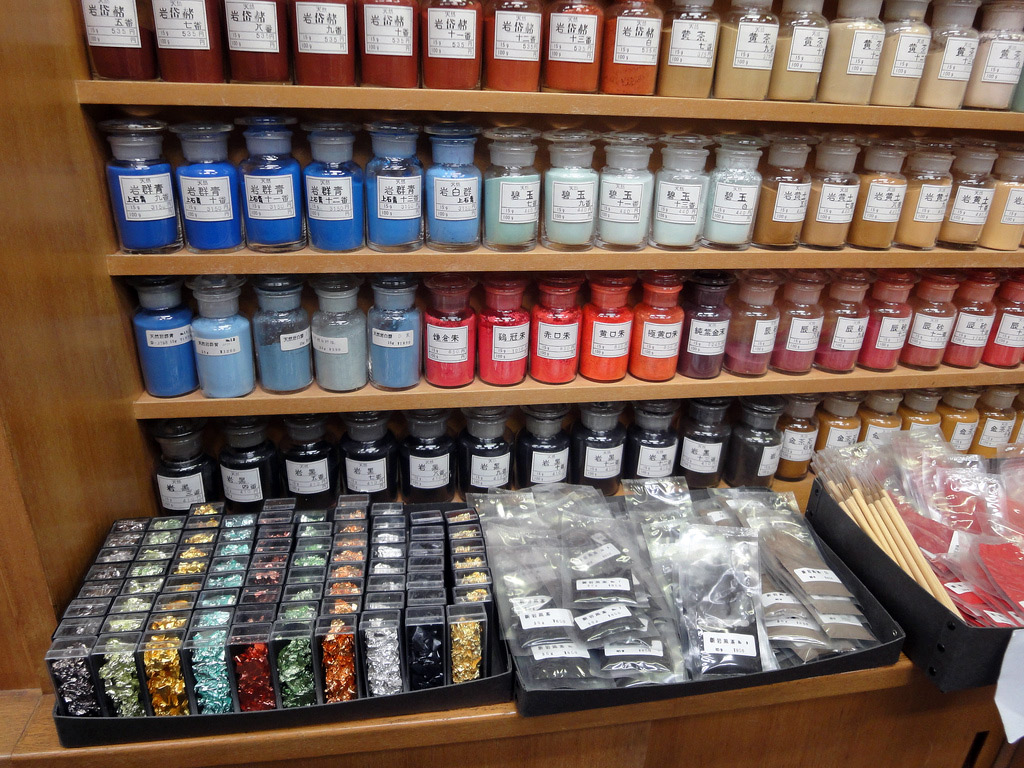 traditional paints and pigments in jars on shelves