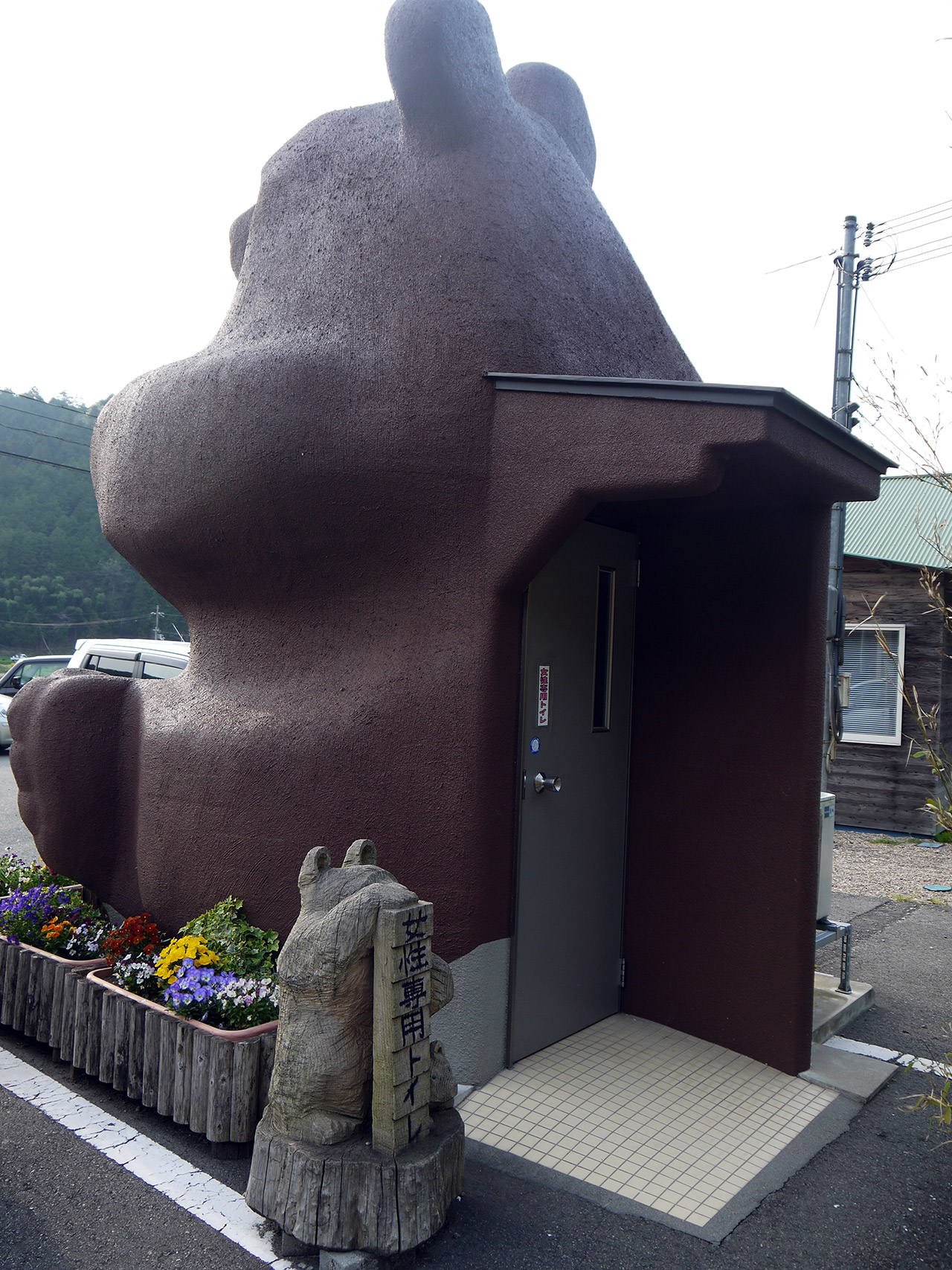 door in the back of a giant bear statue