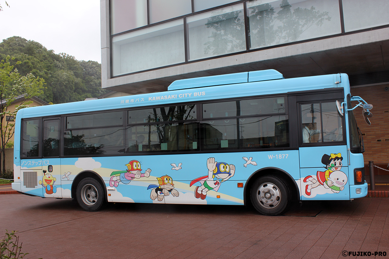 city bus japan with cartoon characters on it