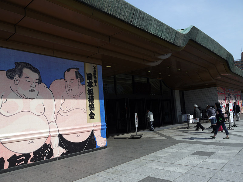 stadium entrance with mural of sumo wrestlers