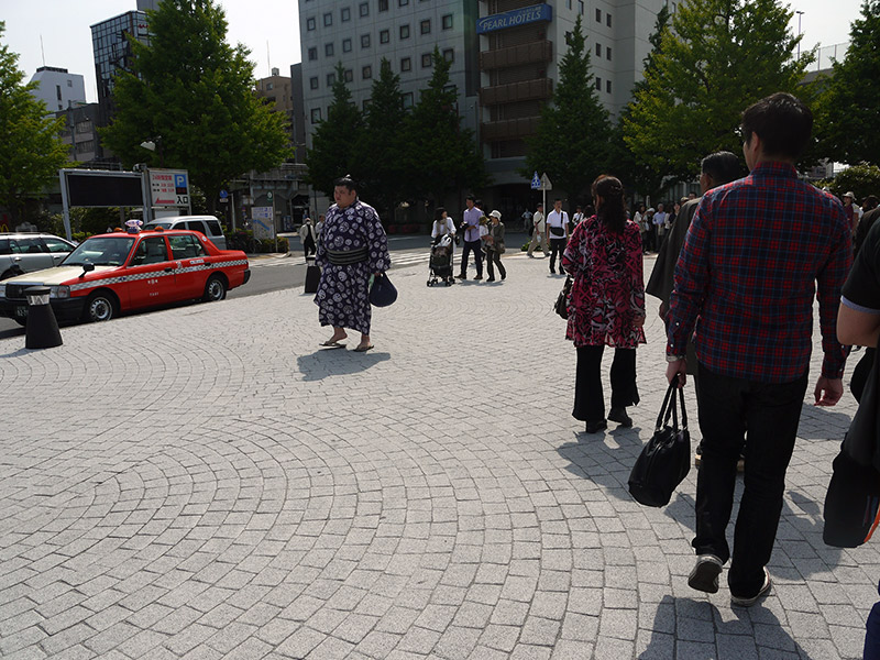 sumo wrestler walking down the street in Japan