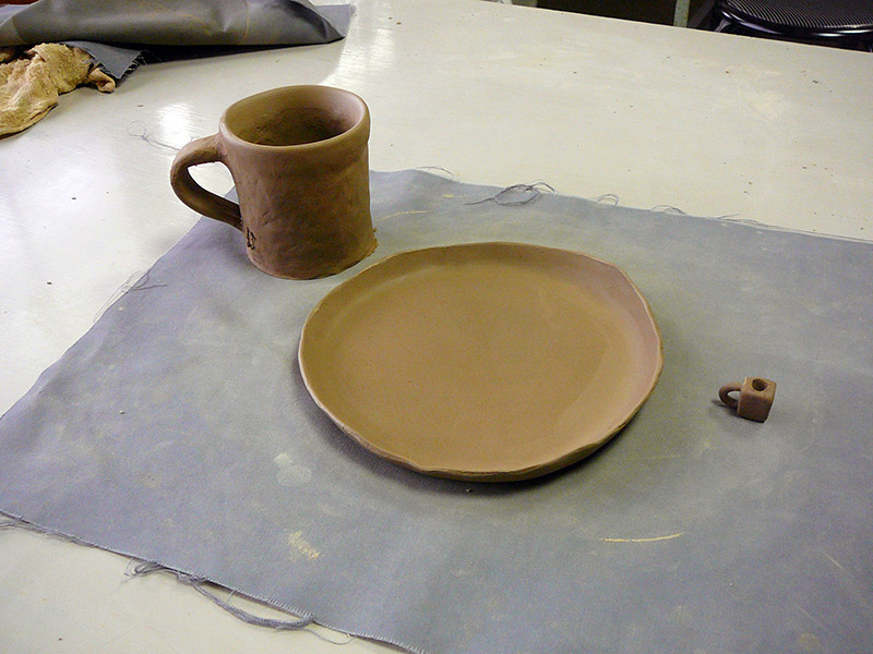 self-made clay mug and plate