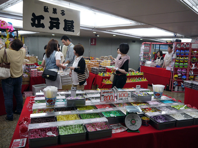 tables with candy and shelves with toys