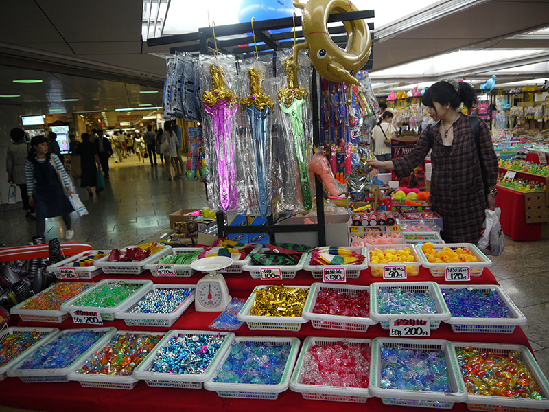 woman browsing toy stand