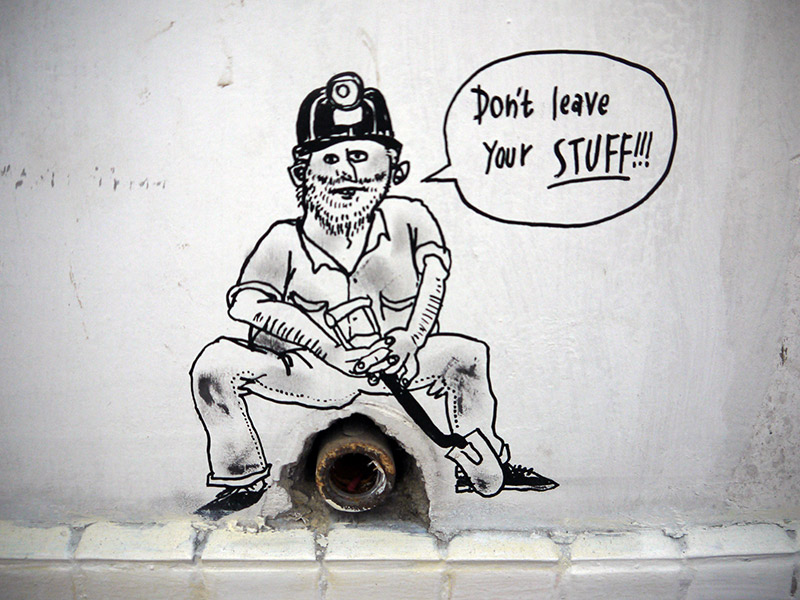 cartoon construction worker drawn on wall