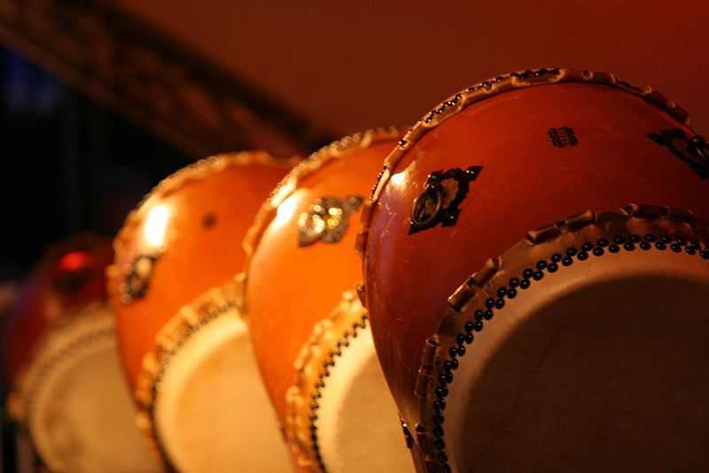 taiko drums in low light four of them