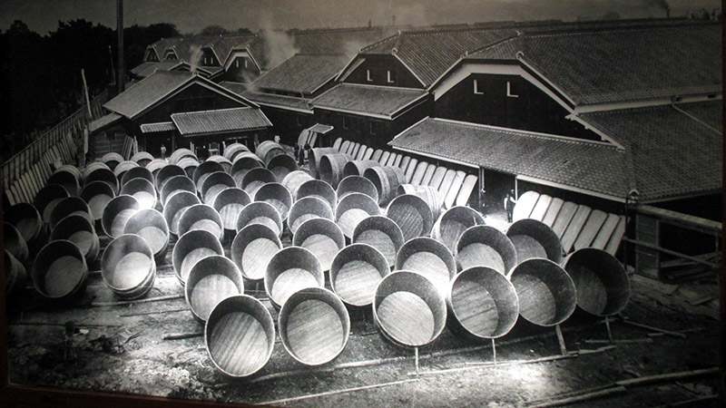 giant sake barrels on the streets of japan