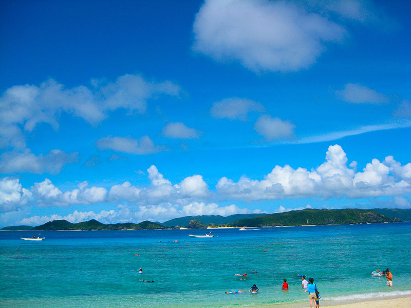 aka island beach with blue skies and clear water