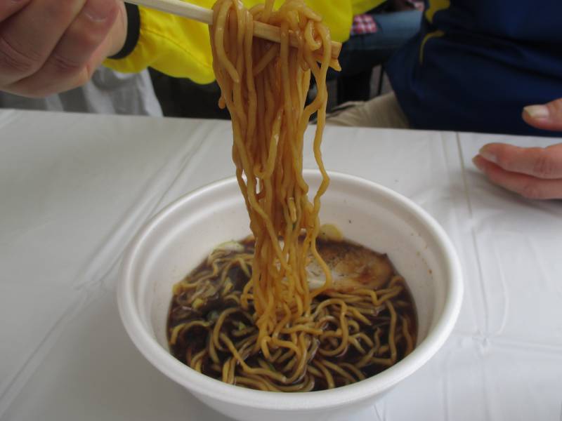 ramen noodles plastic bowl black broth