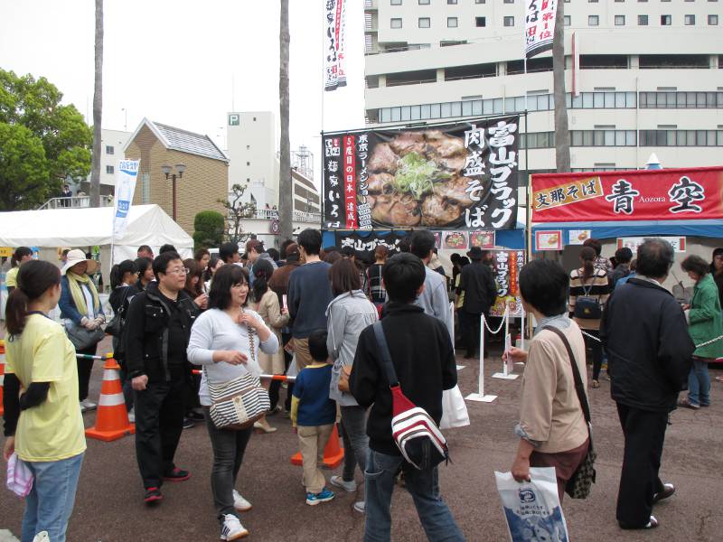 japanese people at a busy ramen festival in tokushima