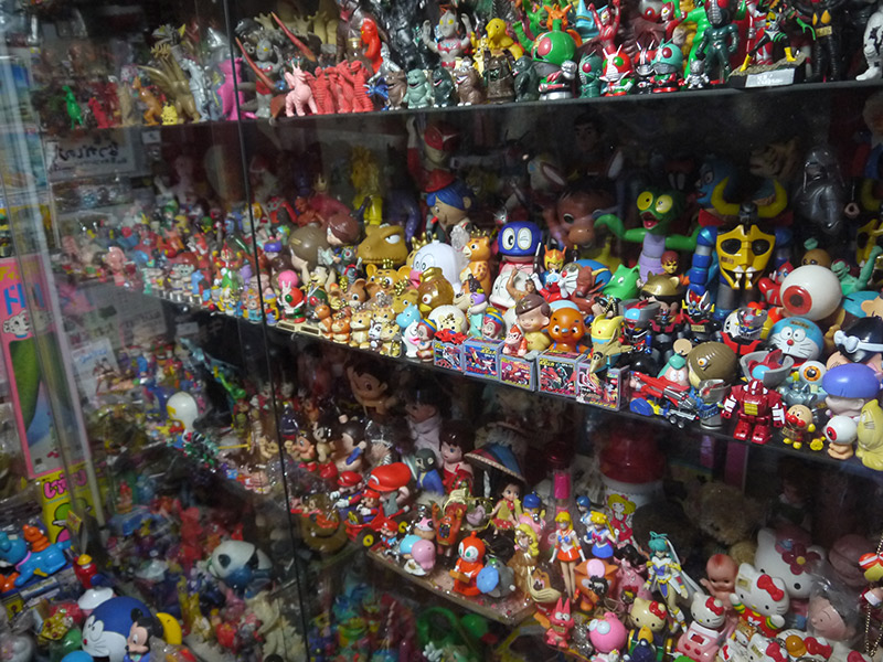 Glass case of various figurines