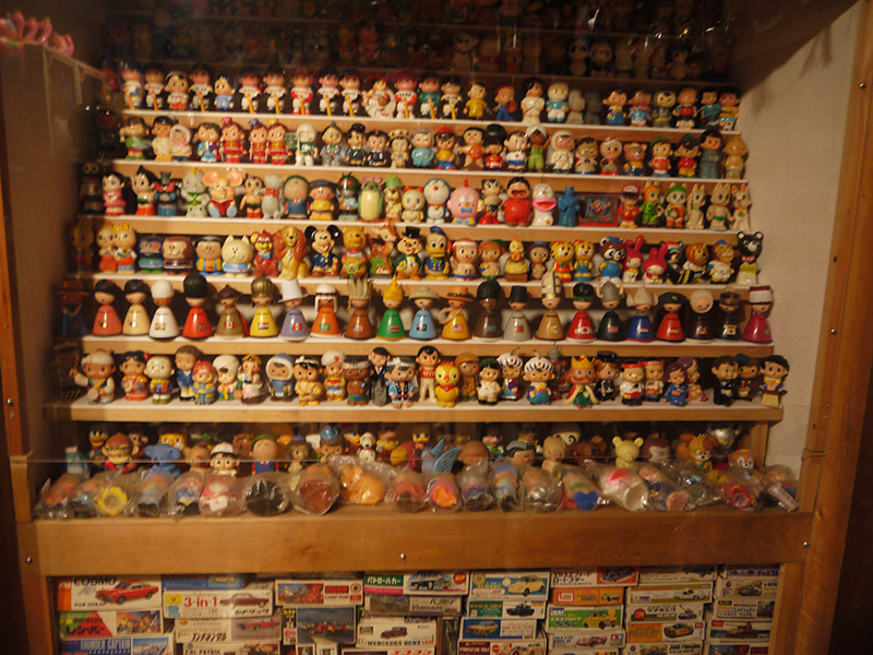 A shelf of small statues and figurines