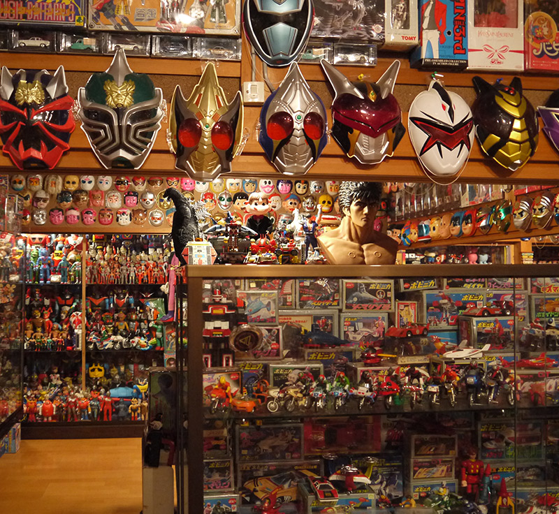 A wall adorned with Ultraman masks