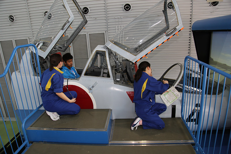 Employees setting up the simulator at the JASDF Air Park