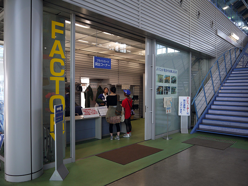 A counter with people renting JASDF costumes