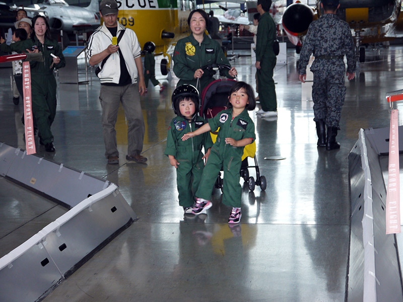 Two kids dressed up as JASDF personnel