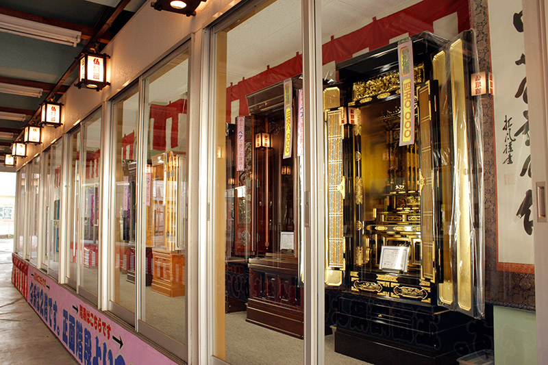 A close-up of one of the displays, which contains a small shrine for sale