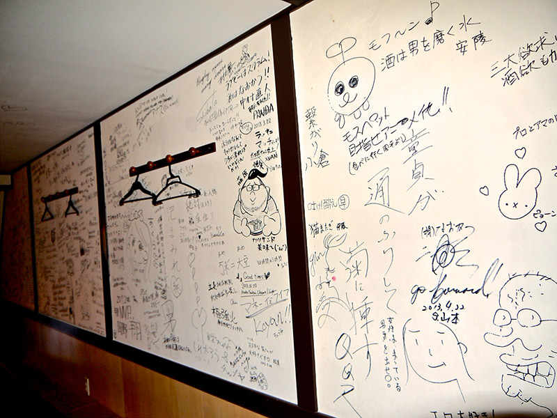 scribbles and doodles from customers on the wall