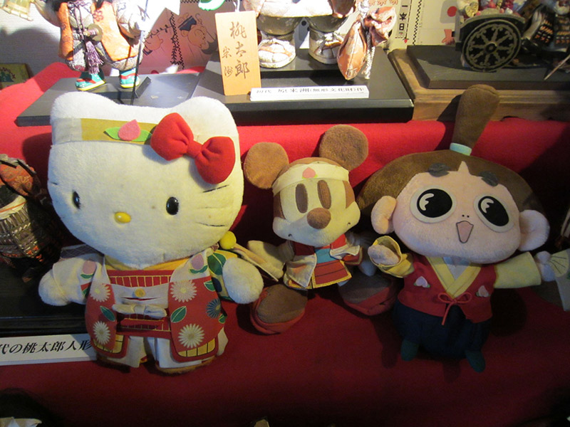 Momotaro, mickey, and hello kitty stuffed dolls