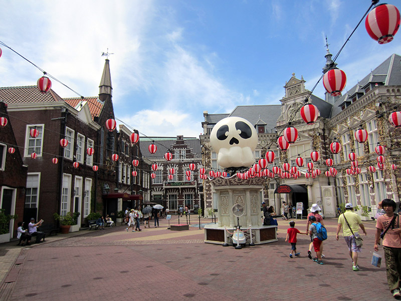 japanese lanterns and panda figurine in an amusement park town square