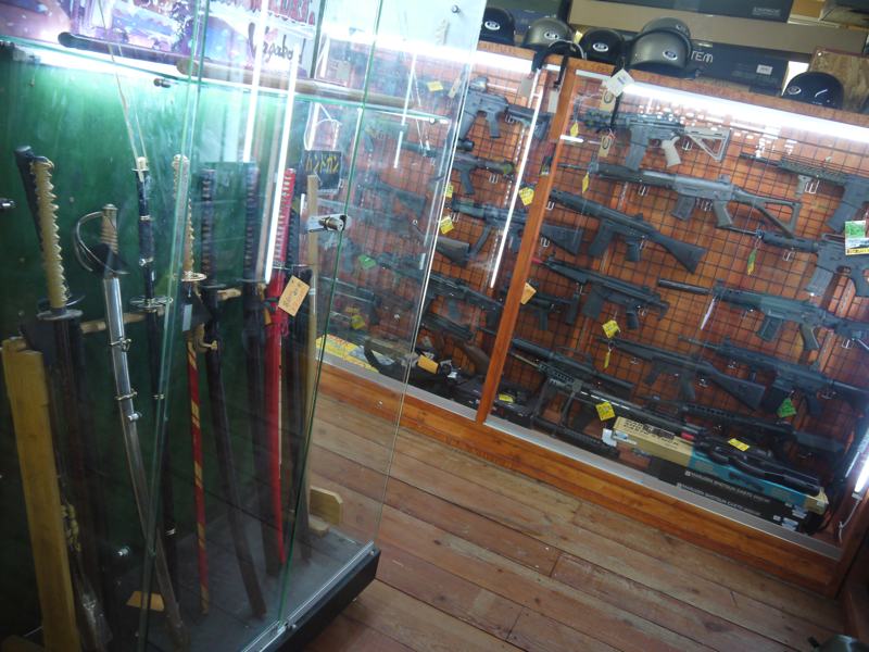 fake swords and fake guns display in cases