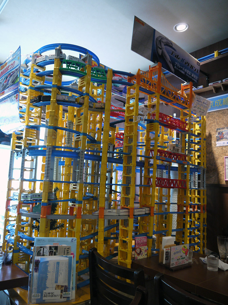 A towering Takara Tomy trainset inside the Plarail Cafe